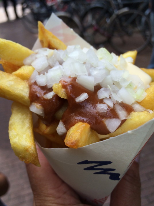 Frites with satesaus (peanut sauce) and onions (Dutch specialty)