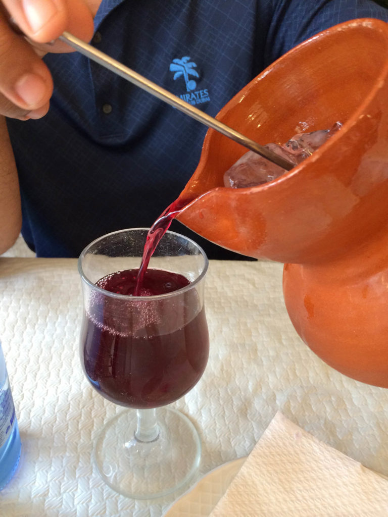 Pouring Homemade Sangria - paella in castelldefels 