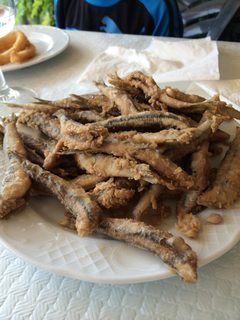 Freshly fried sardines - paella in Castelldefels