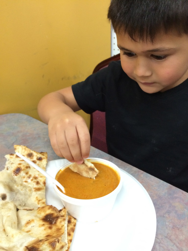 Jaf eating his favorite butter chicken and naan (Indian cuisine)