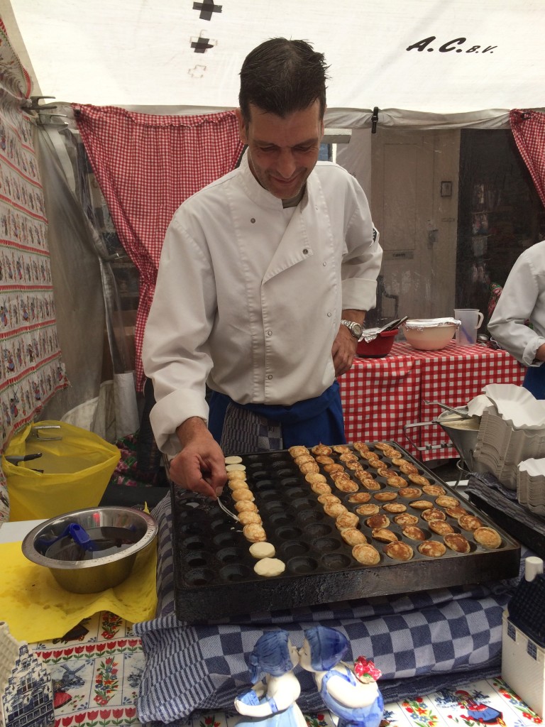 chef making poffertjes - dutch foods to try in amsterdam