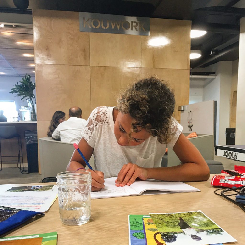 Leah working on The Feeling Flower in a library
